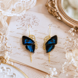 Boucles d'oreille Aponi papillon Ancema Ctesia bleu irisé noir – engrenage doré | Victorian Rehab